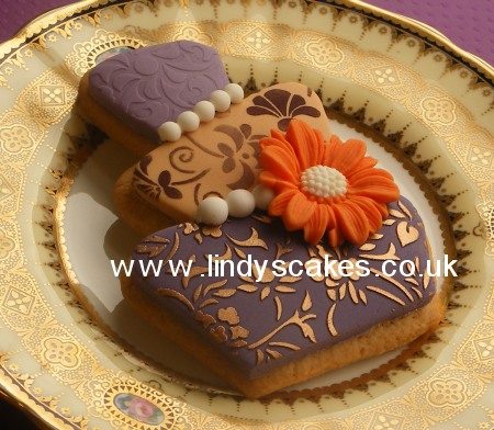 Purple and gold wonky wedding cookie by Lindy Smith
