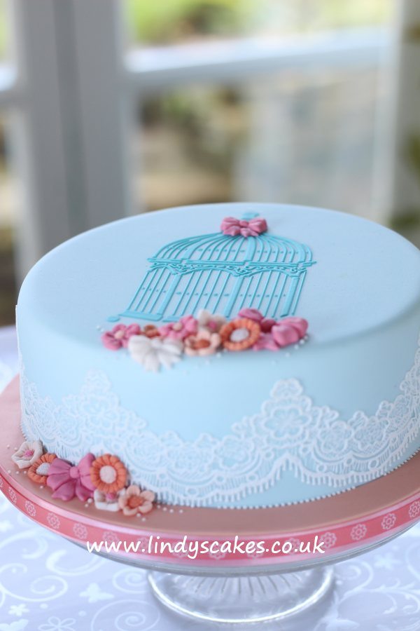 One tier vintage inspired birdcage stenciled cake in aqua and peach by Lindy Smith