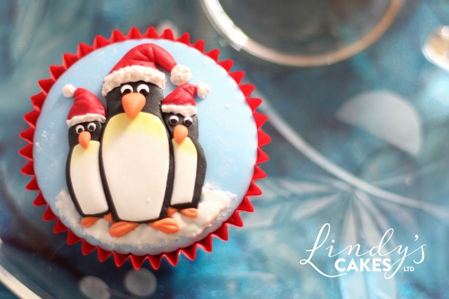 Christmas penguins on a cupcake by sugarcraft artist Lindy Smith