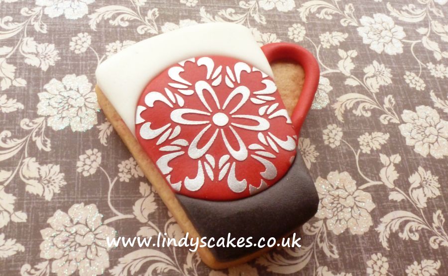 stencilled mug cookies by sugarcrafter Lindy Smith