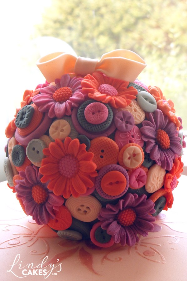 Vintage inspired ball posy cake with moulded buttons and flowers by Lindy Smith