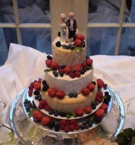 Sarah and Rod on top of their wedding cake of cheeses