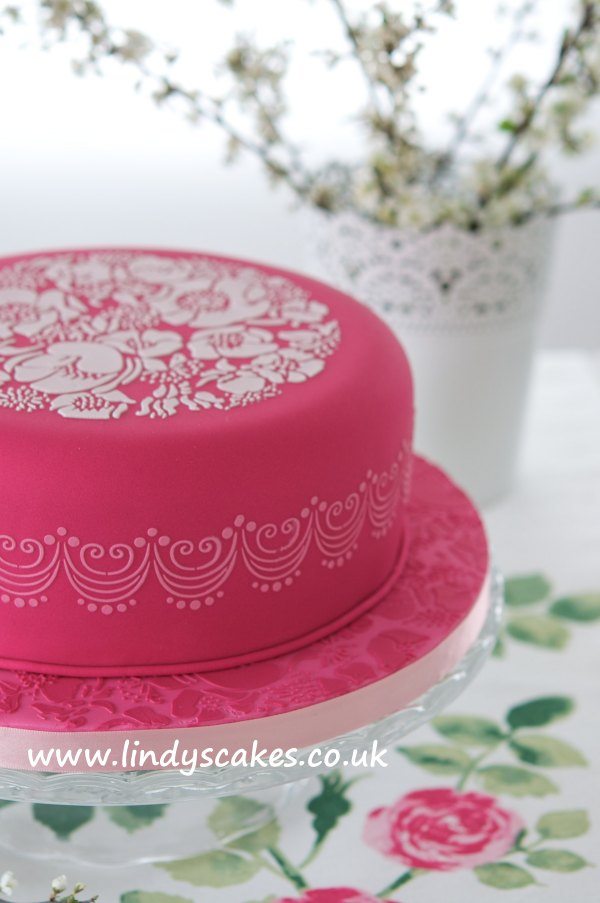 Lindy's species rose stencil used to decorate a pretty pink cake for Mother's Day