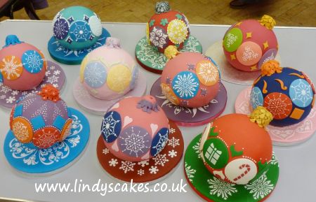 Colourful Christmas bauble cakes created in class with Lindy Smith