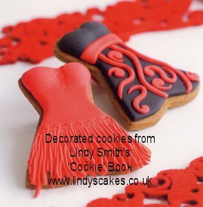 party dresses made from baked biscuits and decorated with red and black sugarpaste