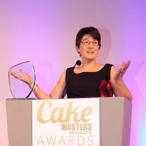 Lindy Smith presenting an award at the Cake Masters Awards ceremony