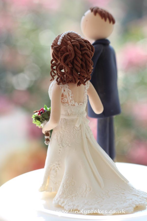 A personalised bride and groom cake topper by Lindy Smith