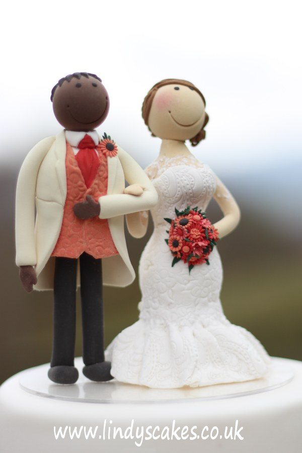 Bespoke bride and groom cake topper for an autumn themed wedding