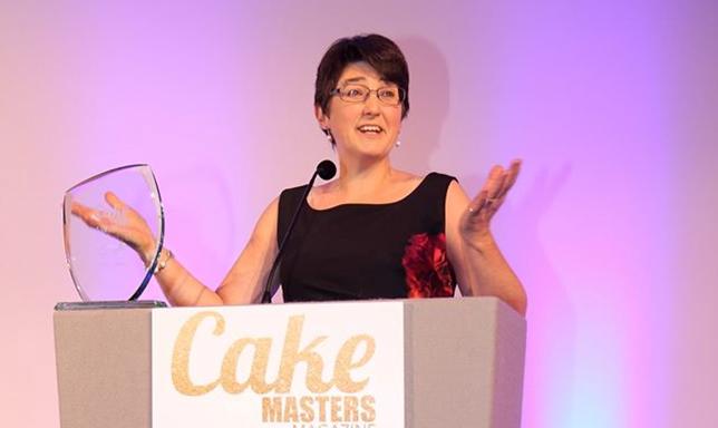 Lindy Smith In action up on the Cake Masters Award stage