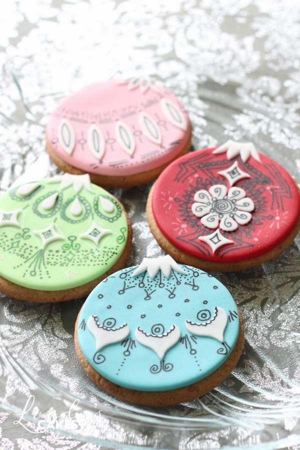 Christmas bauble cookie idea - decorated with cut outs and a fluid writer by award winning cake designer Lindy Smith